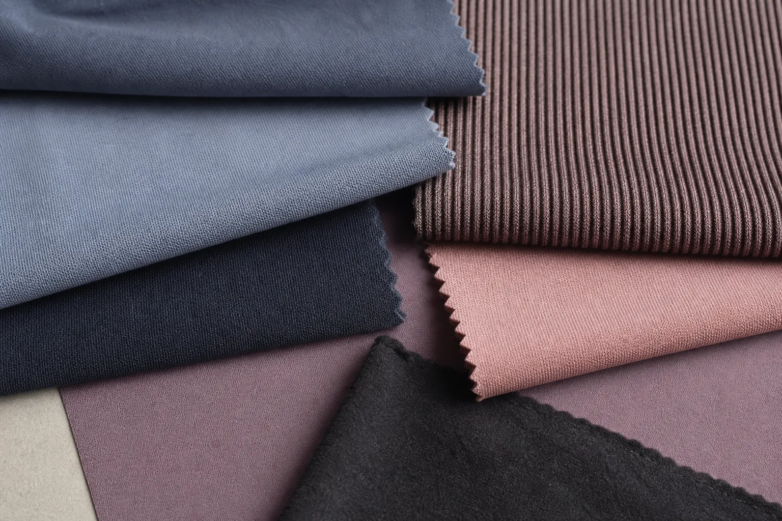 Activewear fabric swatches in different shades and textures