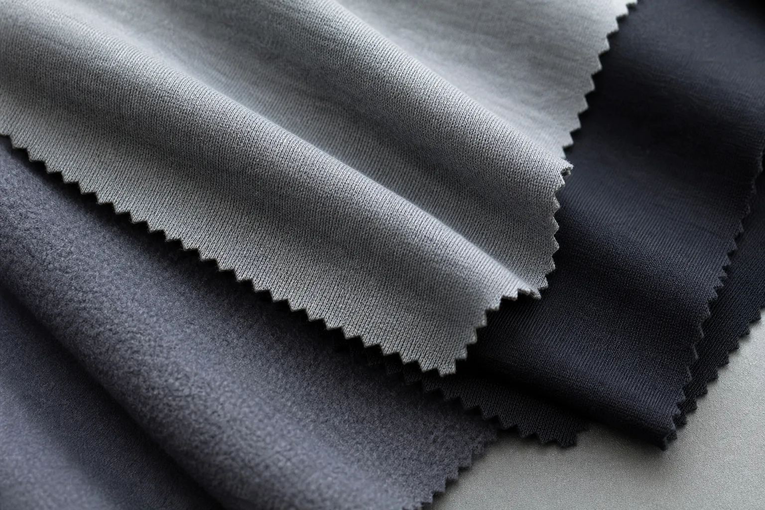 Stretch fabric swatches for men's yoga apparel with visible texture