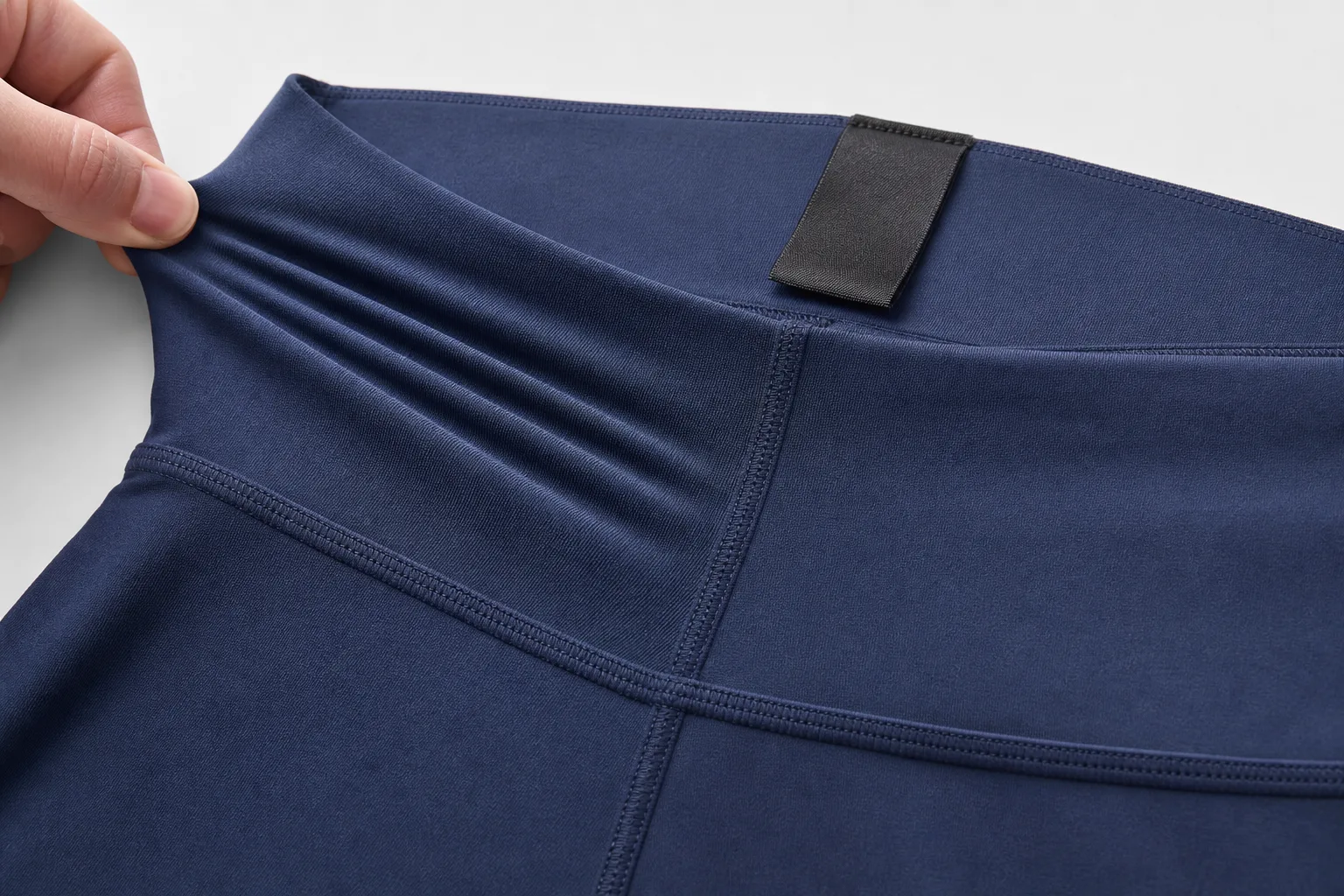 Close-up of activewear fabric, waistband, and seam construction